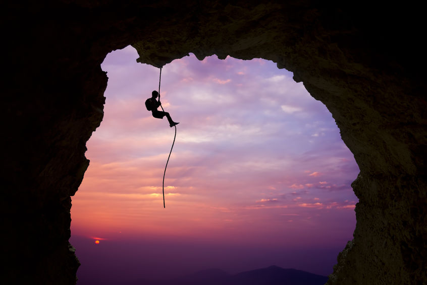 Rock Climber Over Sunset